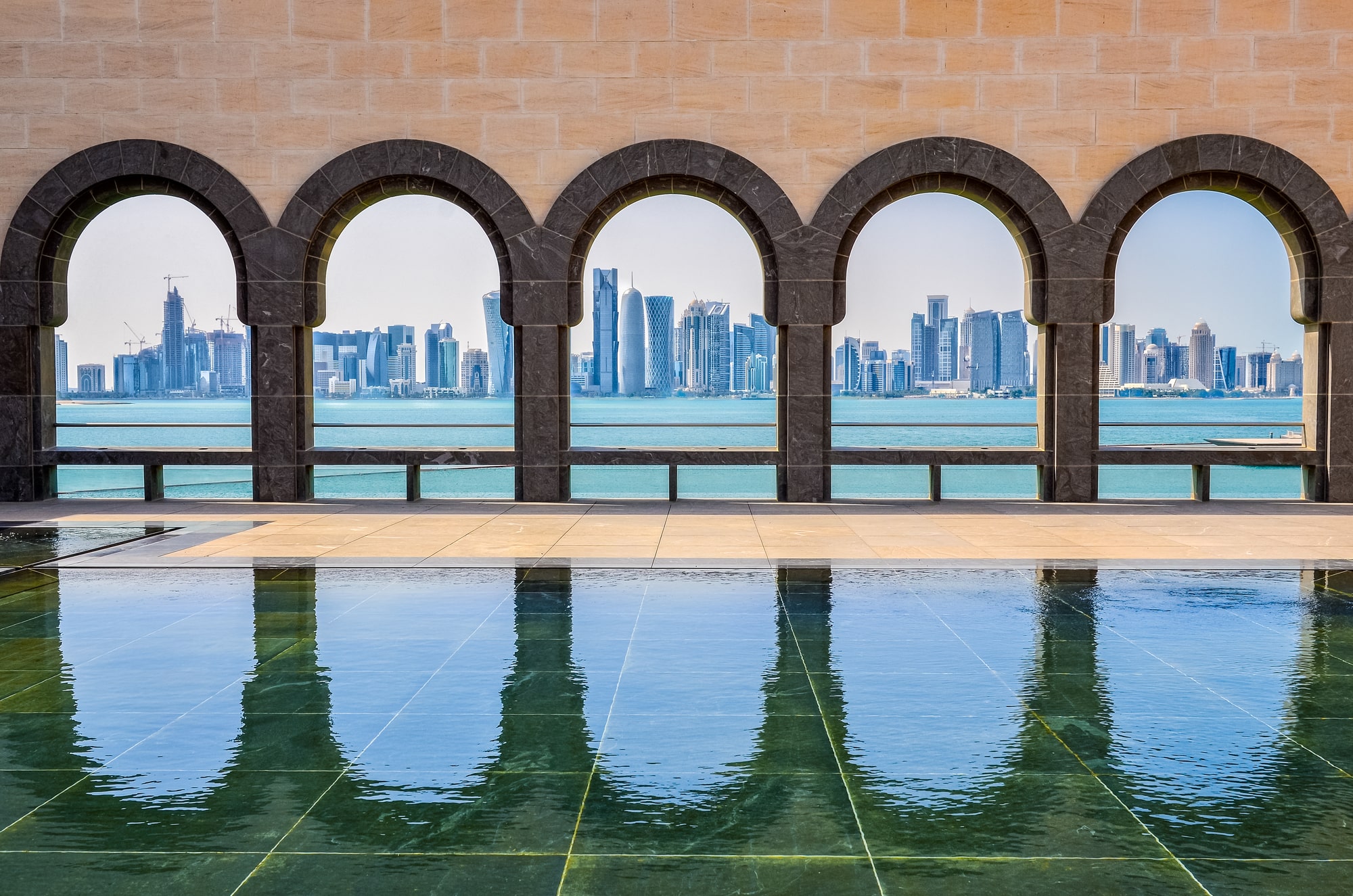 qatar skyline through the mosque windows