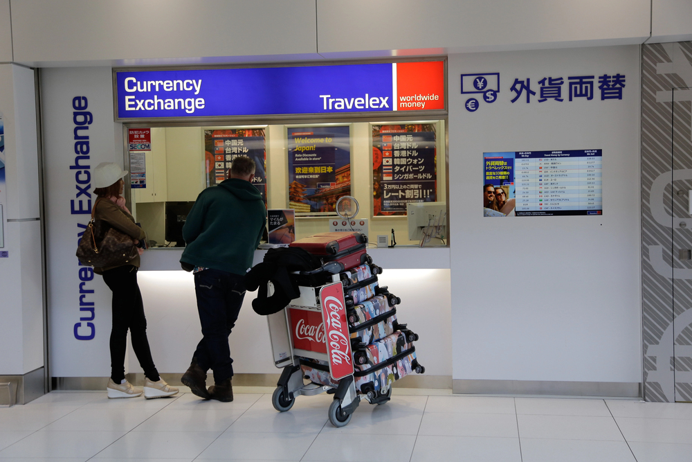 Tourist at Currency Exchange store at New Chitose Airport, Japan